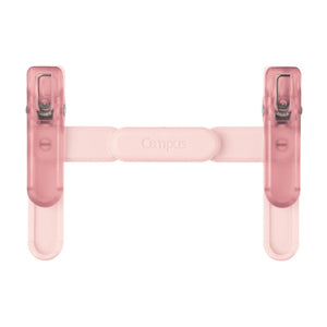 A pink Campus brand H-shaped desk organizer with two translucent clip-style ends and a central horizontal bar, shown on a plain white background.