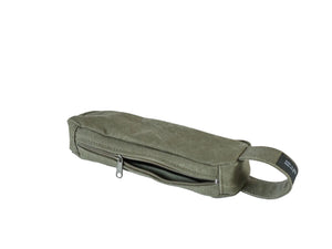 An olive green canvas pouch with a zippered top and a loop handle, nomado store.