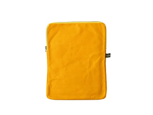 A mustard yellow fabric sleeve or pouch with a zipper closure, standing upright against a plain white background.