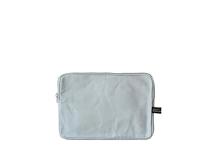 A light gray fabric pouch or sleeve with a zipper closure and a small black brand tag on the right side, displayed against a clean white background.