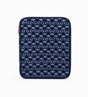 A navy blue zippered sleeve featuring a textured geometric diamond pattern in lighter blue and navy, with a small gold zipper pull on the left side, shown against a plain white background.