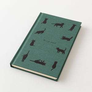 A hardcover notebook with a textured teal-green cover decorated with black cat silhouettes and the handwritten text 'Dippy 2027' in the center, shown on a clean white background.