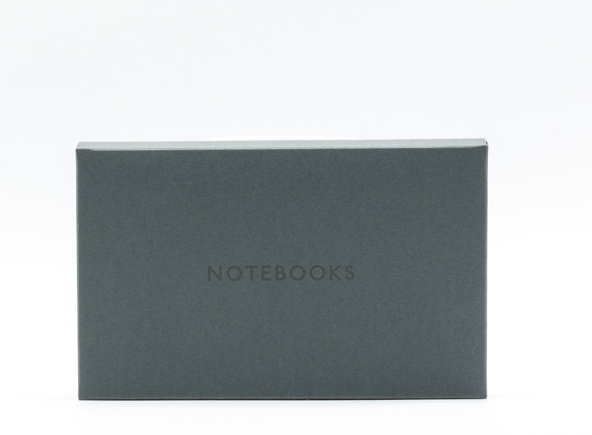 Pack of three grey pocket notebooks