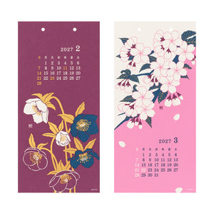 Two hanging wall calendars shown side by side. The left calendar for February is deep plum purple with white, yellow, and blue floral illustrations and a 2027 calendar grid.