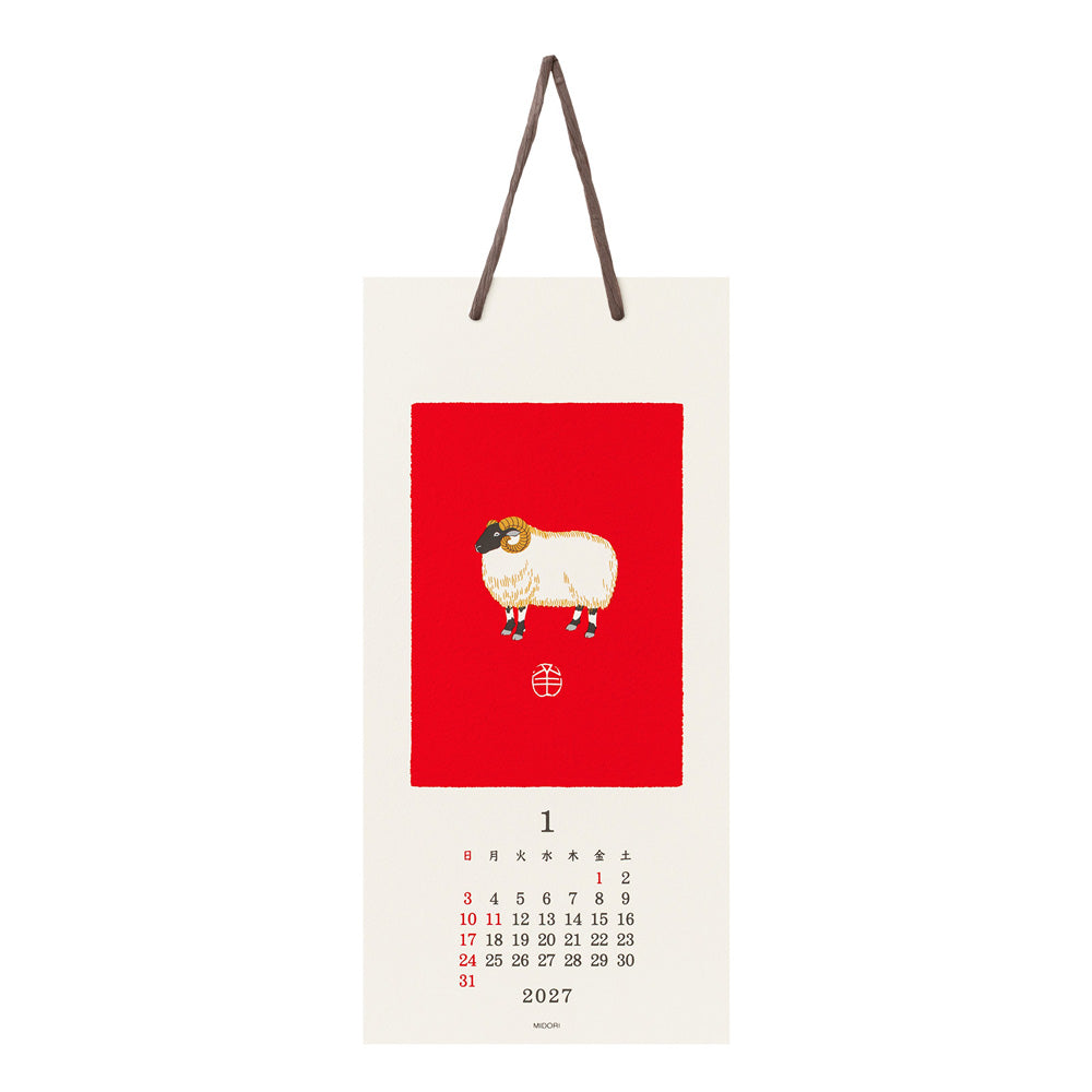 A hanging wall calendar page for January 2027 with a cream background, a large red square featuring a stylized sheep illustration, and a small monthly calendar grid at the bottom.