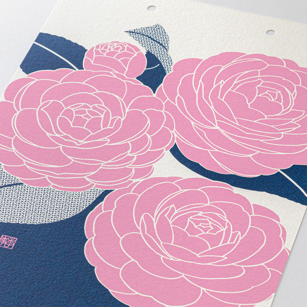 Japanese-style floral art print featuring three large pink camellia-like flowers with white outlines on a cream background, with dark blue textured leaves and stems.