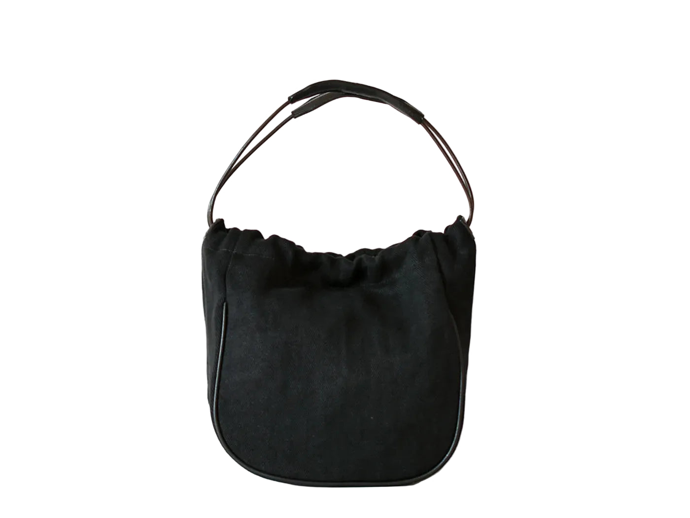 A black suede crescent-shaped shoulder bag with a thin black leather top handle, photographed against a clean white background.
