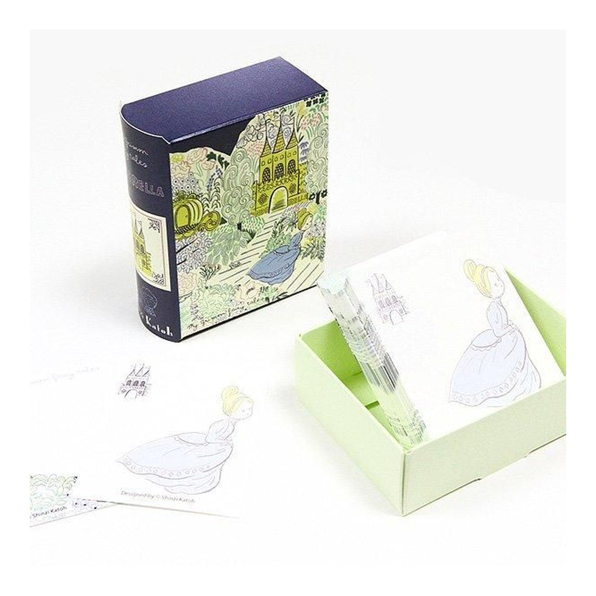 A set of illustrated notes and matching packaging on a white background. The box is dark purple with a whimsical castle illustration, and the sticky notes inside a pale green tray show a girl in a white dress. Cinderella