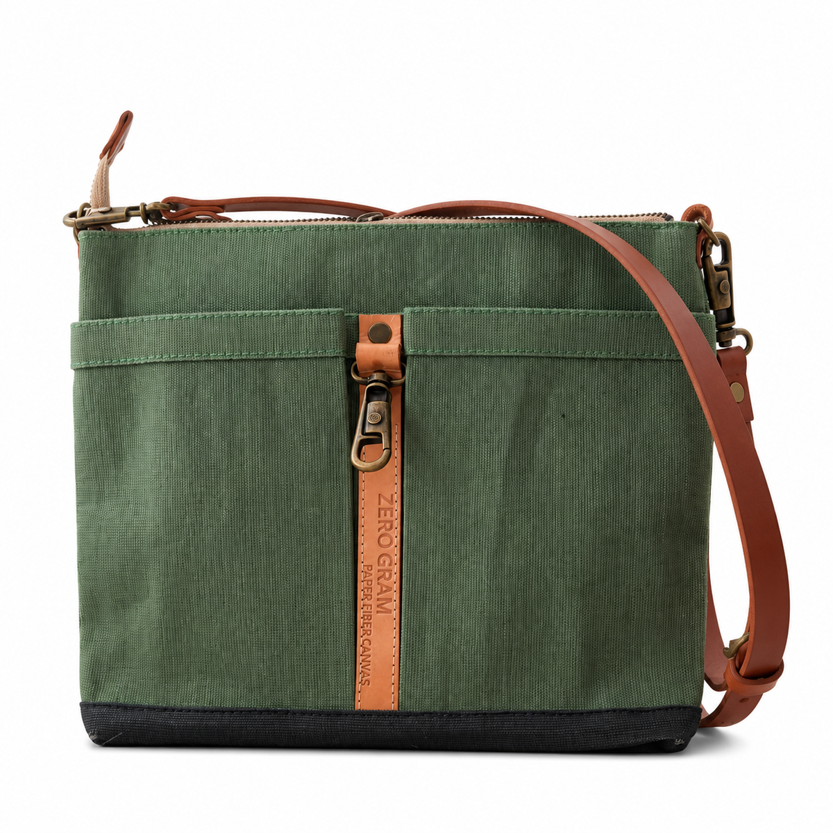 An olive green canvas crossbody bag with brown leather trim, a vertical leather brand tab reading 'ZERO GRAVITY CLOTHING', and a black bottom base, shown on a white background.