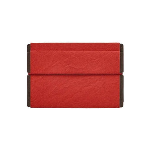 A red textured envelope-style clutch or sleeve with dark brown side panels, shown flat against a white background.