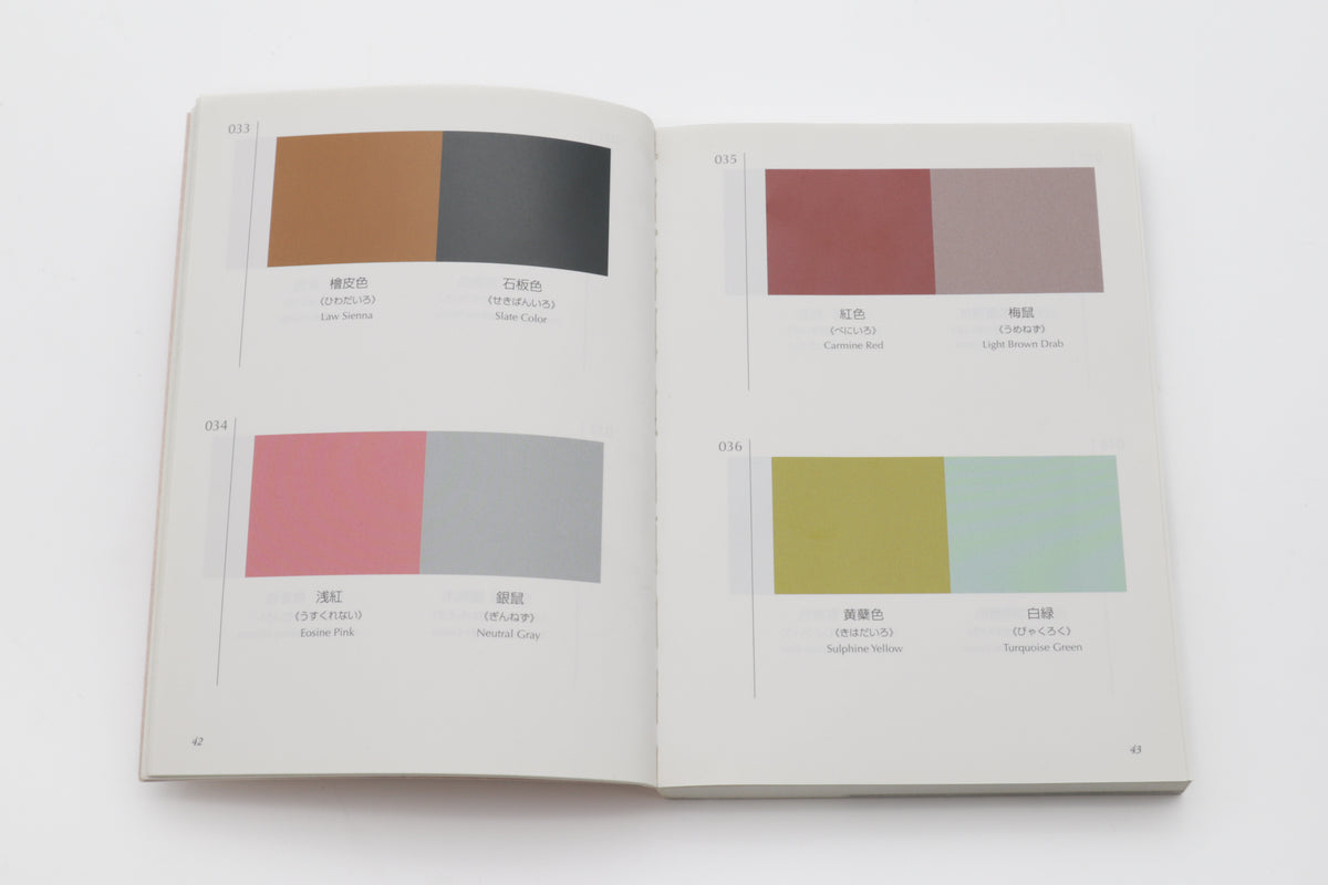Open book displaying color swatches on a white background