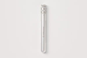 A sleek, metallic silver cylindrical device with engraved branding reading 'Ammusion' on its side, set against a solid light gray background.