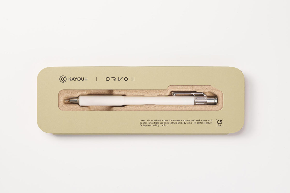 A Kayou+ Orvo II ballpoint pen in a cream and silver colorway, presented inside its light beige rectangular packaging box on a clean white background.