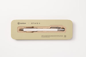 A Kayou+ Orvo II ballpoint pen in a cream and silver colorway, presented inside its light beige rectangular packaging box on a clean white background.