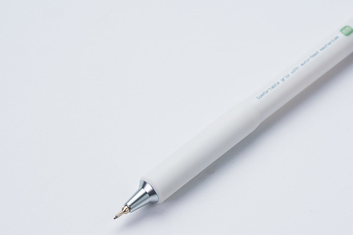 A white mechanical pencil with a silver metal tip, shown diagonally on a clean white background.