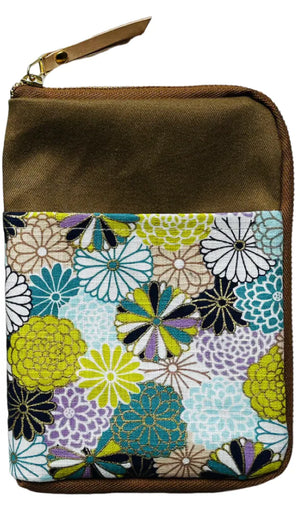 Brown pouch with floral patterned flap on a white background