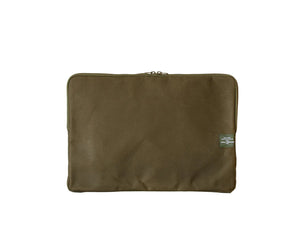 Green fabric pouch with a patch on a white background