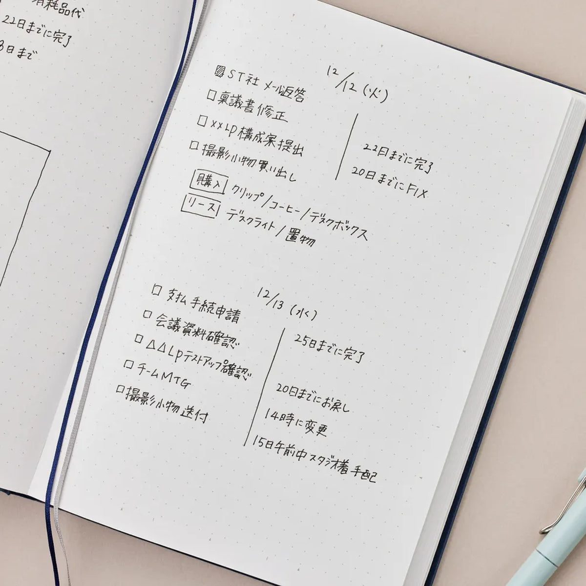 Notebook with handwritten text on a beige surface
