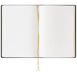 An open notebook with white grid pages, a black cover edge, and a yellow-and-white elastic bookmark ribbon, shown against a plain white background.