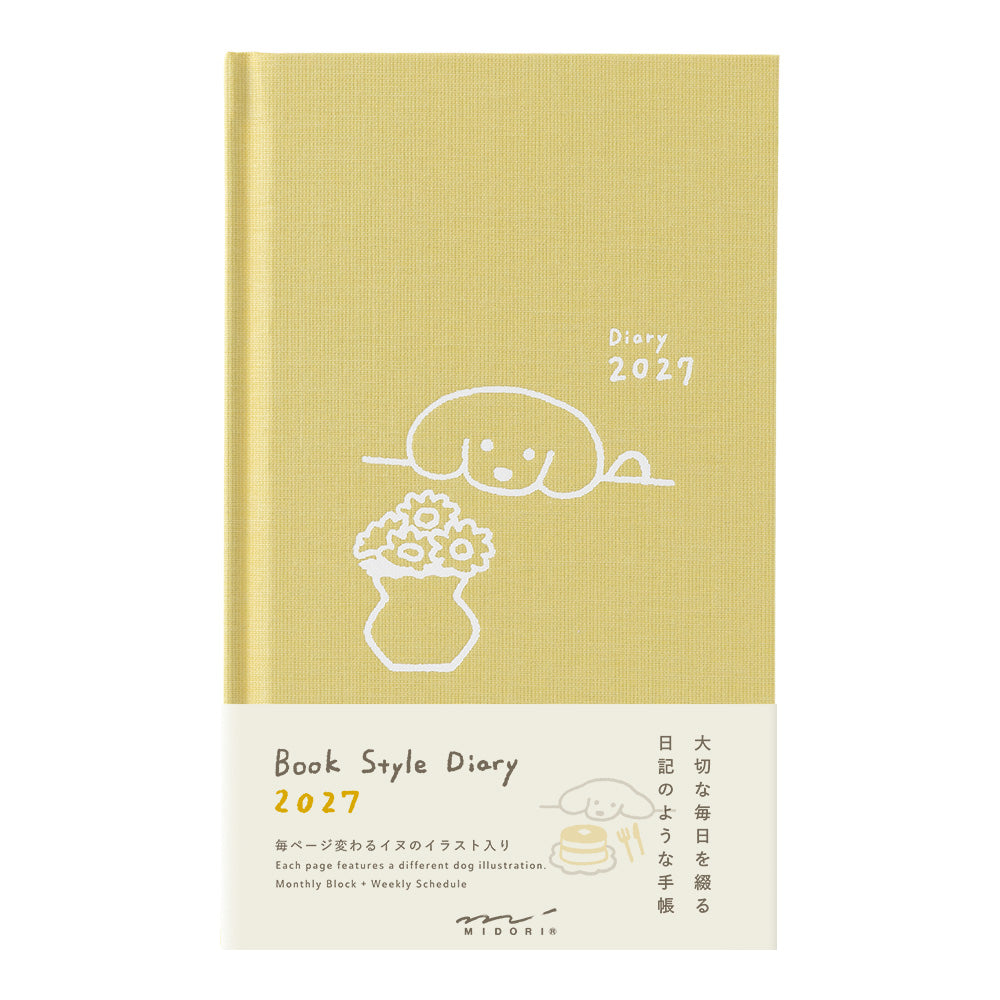 A book-style 2027 diary with a pale yellow cover and cream lower section, featuring simple line-art illustrations and Japanese text. The product is photographed against a plain white background.