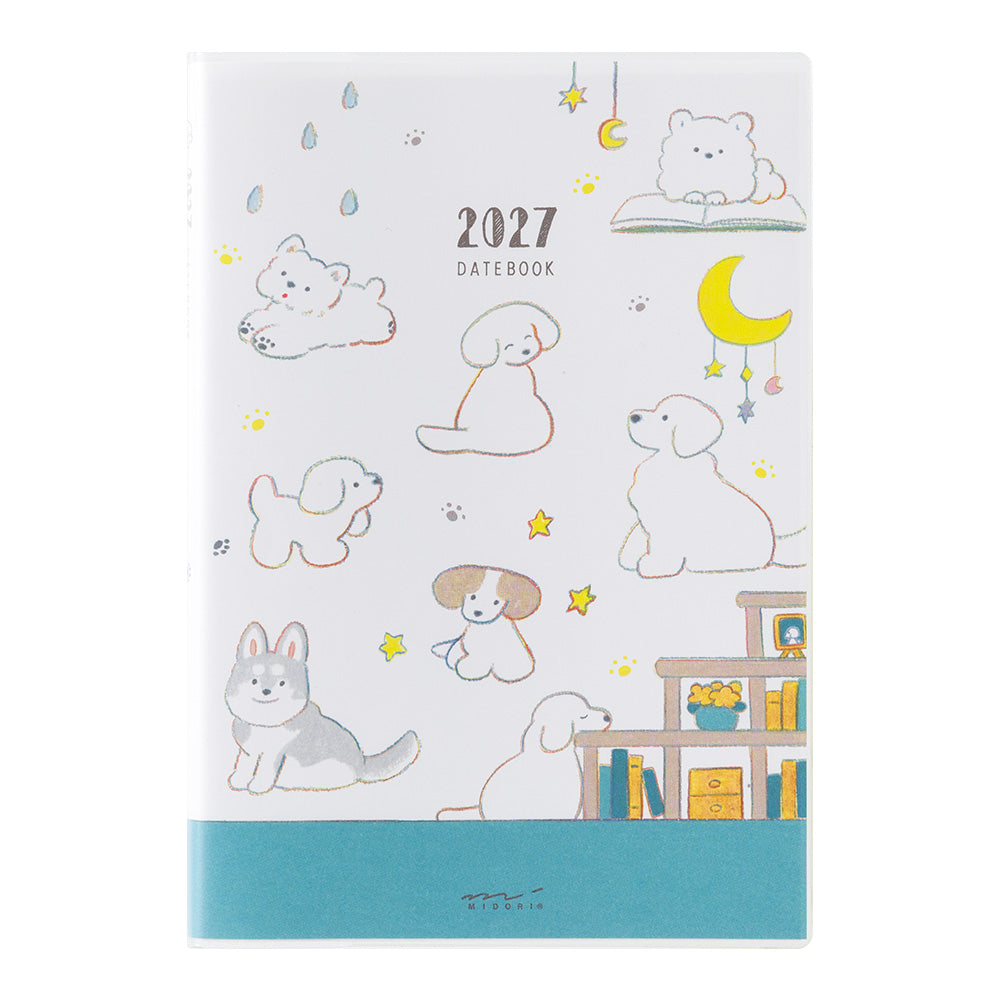 A 2027 daily planner dated '2027 DATEBOOK' on a white cover decorated with cute cartoon dog illustrations, a yellow crescent moon, stars, and a teal band at the bottom.