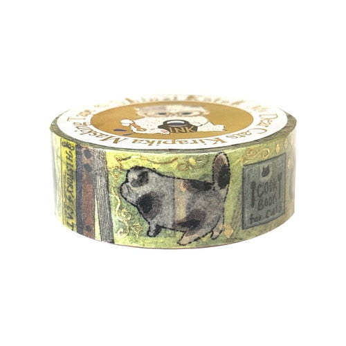 A roll of decorative washi tape featuring vintage-style illustrations, including a black-and-white dog and a postcard design, on a white background.