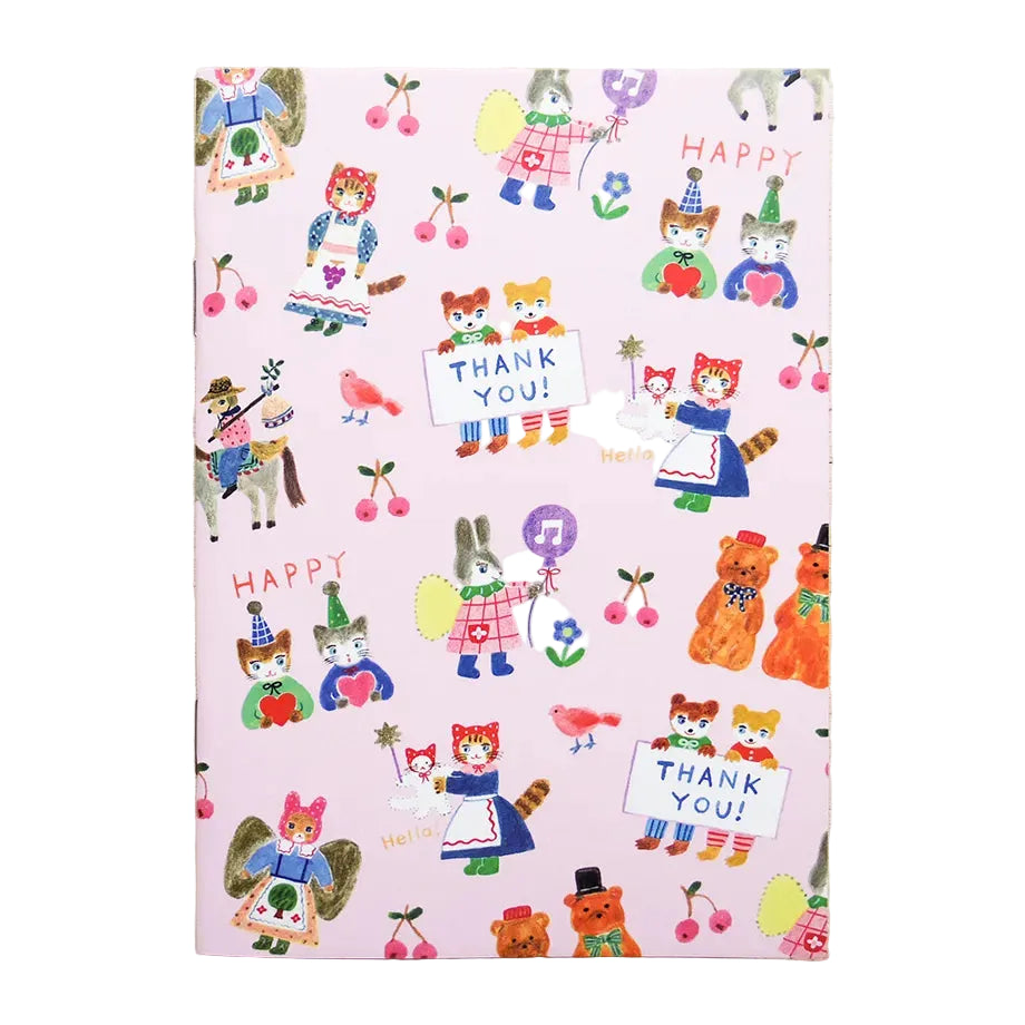 Notebook with colorful animal illustrations and 'Thank you!' text on a light wooden surface
