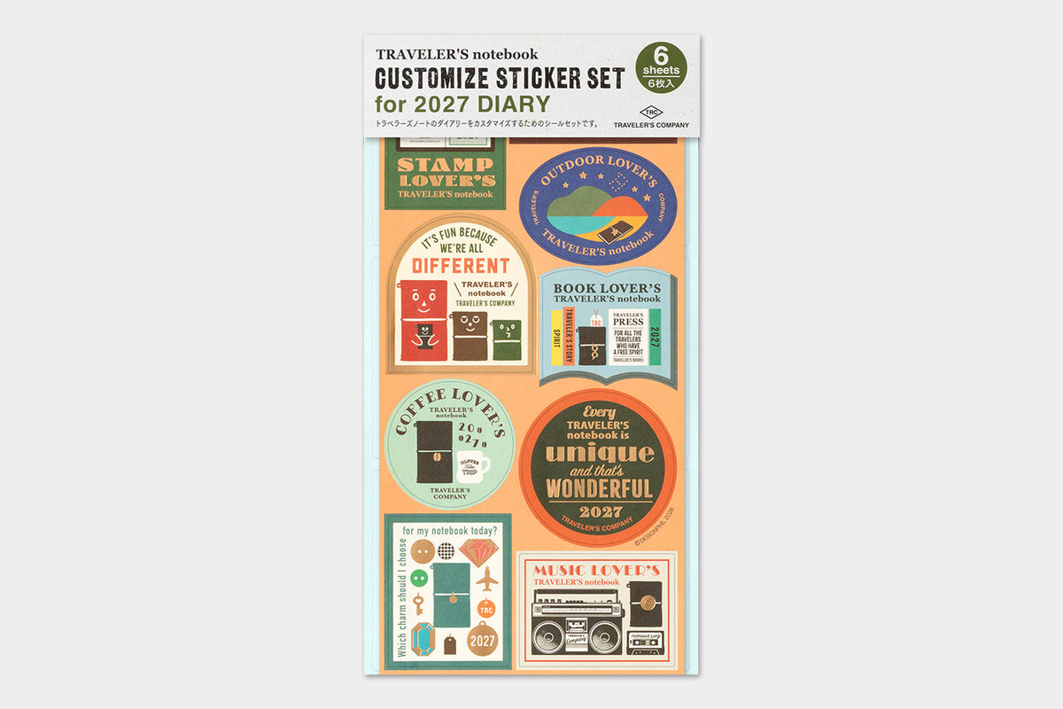A packaged customizable sticker set for a 2027 diary, featuring multiple retro-style travel-themed stickers on a peach and white card backing, photographed against a light gray background.