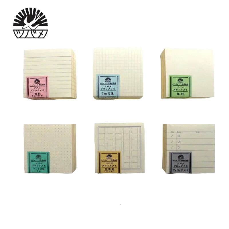 Set of small notebooks with labels on a light gray background
